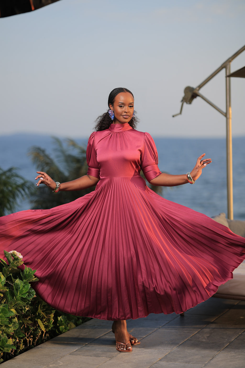 The Suubi Burgundy Pleated Maxi Dress