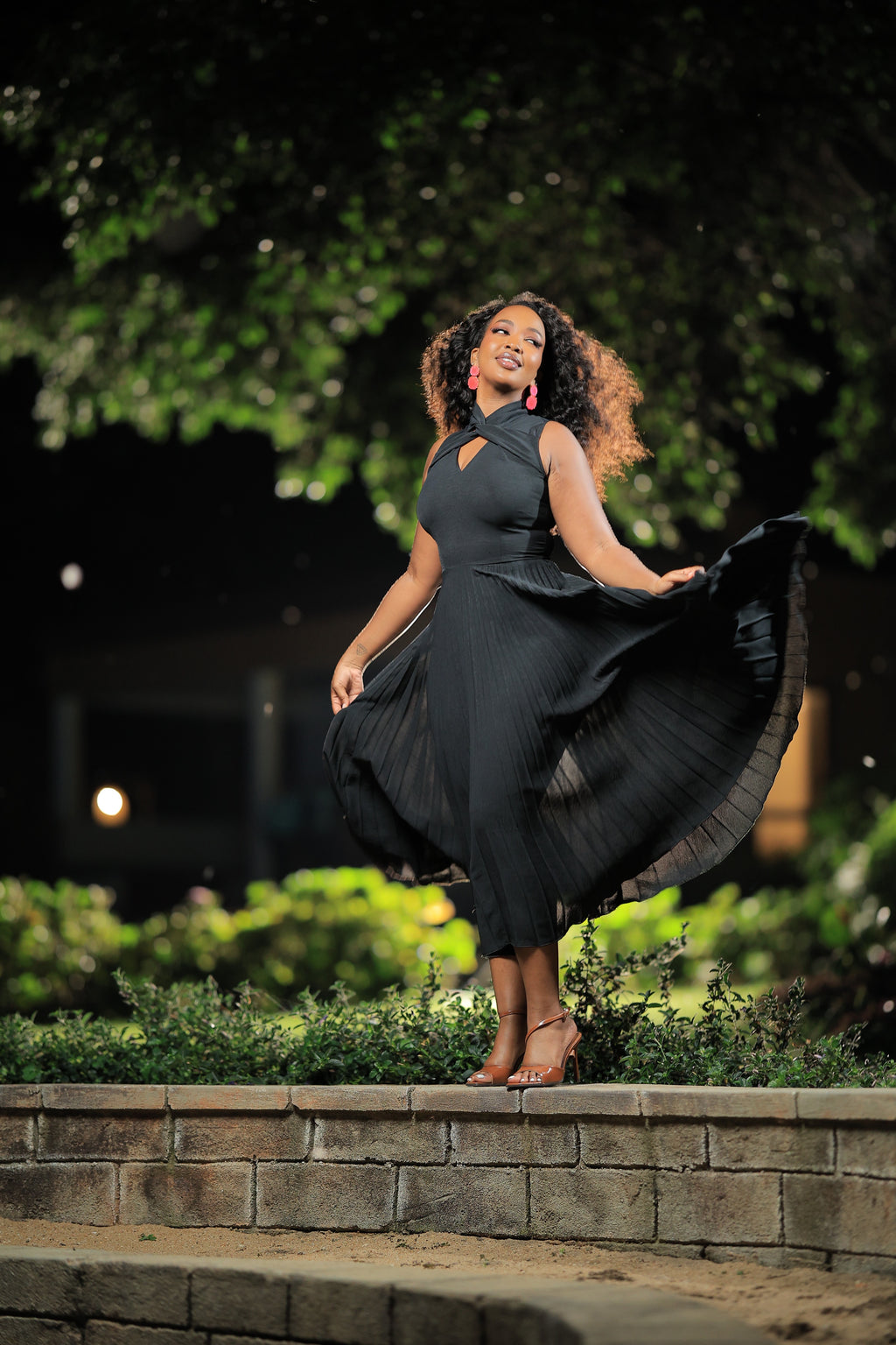 The Wimbi Black Twist Neck Pleated Skater Maxi Dress