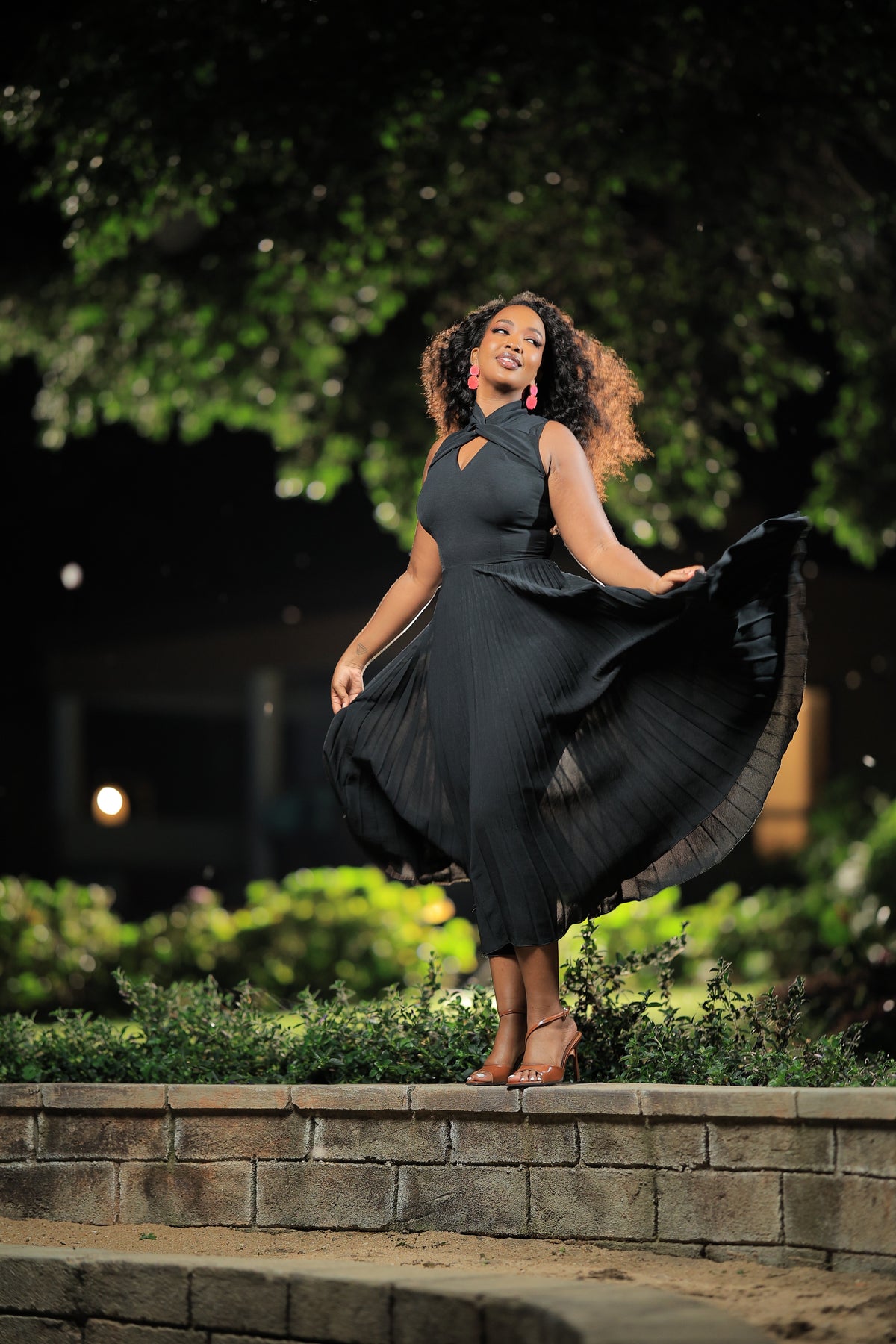 The Wimbi Black Twist Neck Pleated Skater Maxi Dress